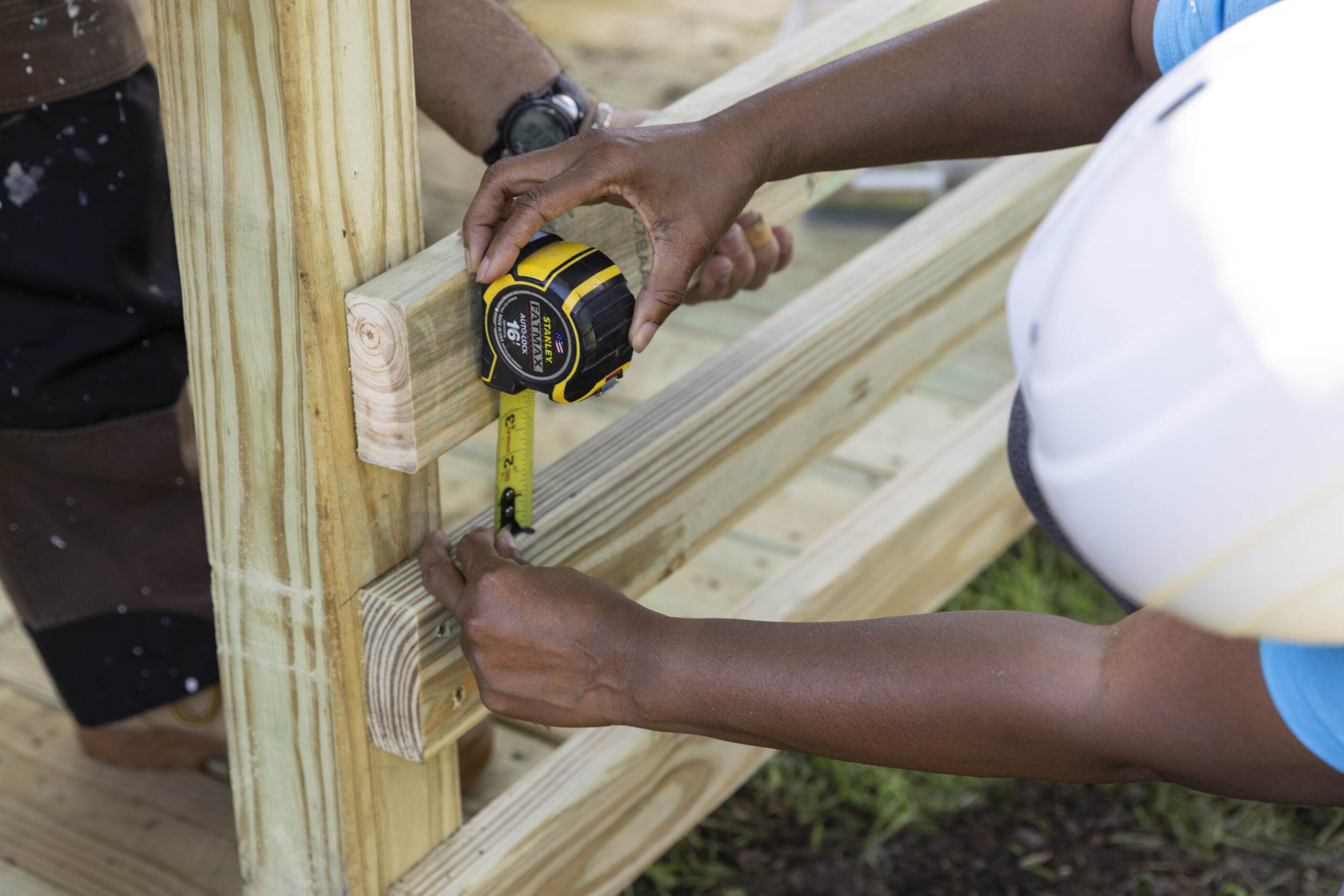 Person measuring wood